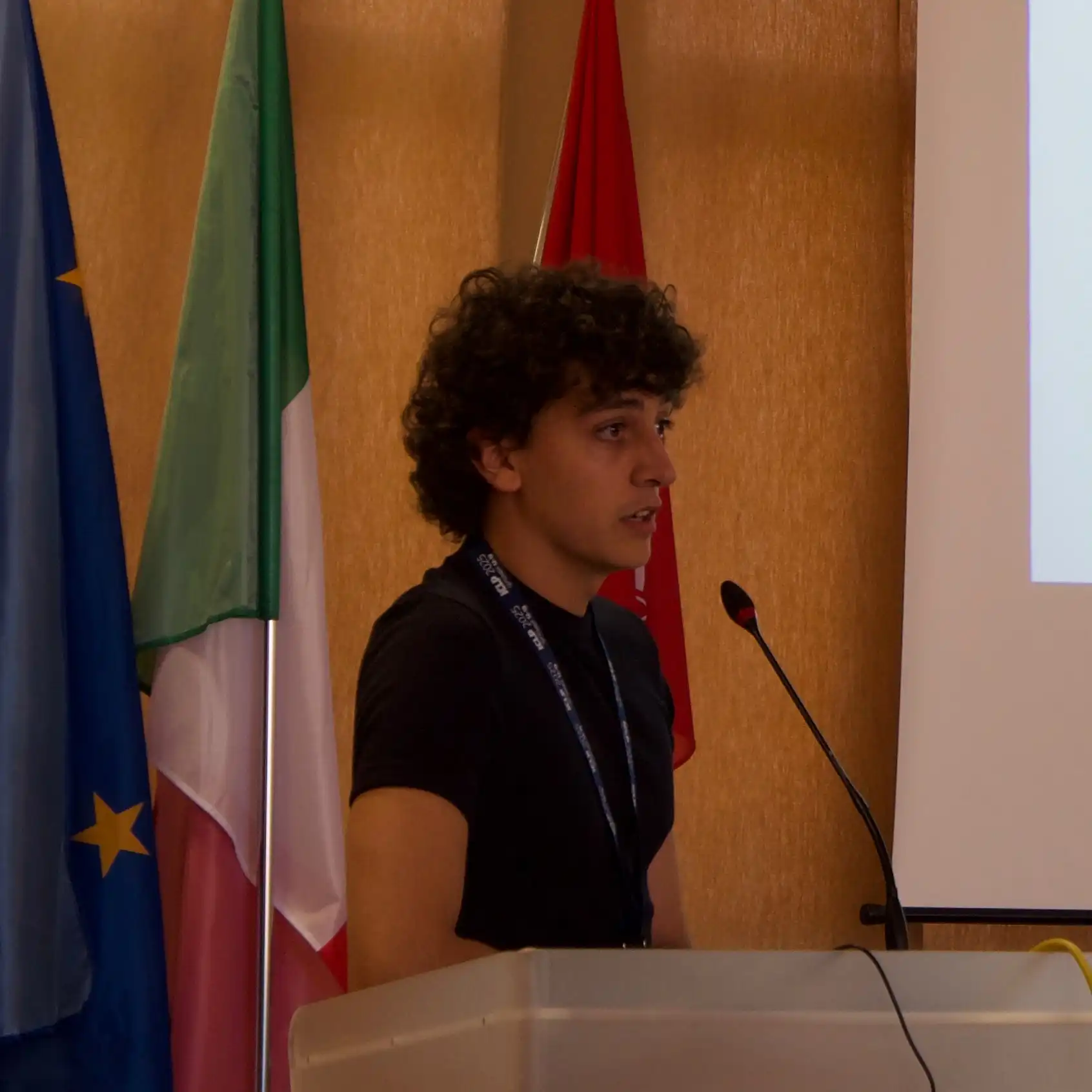 Giving a talk at ICLP'25.
